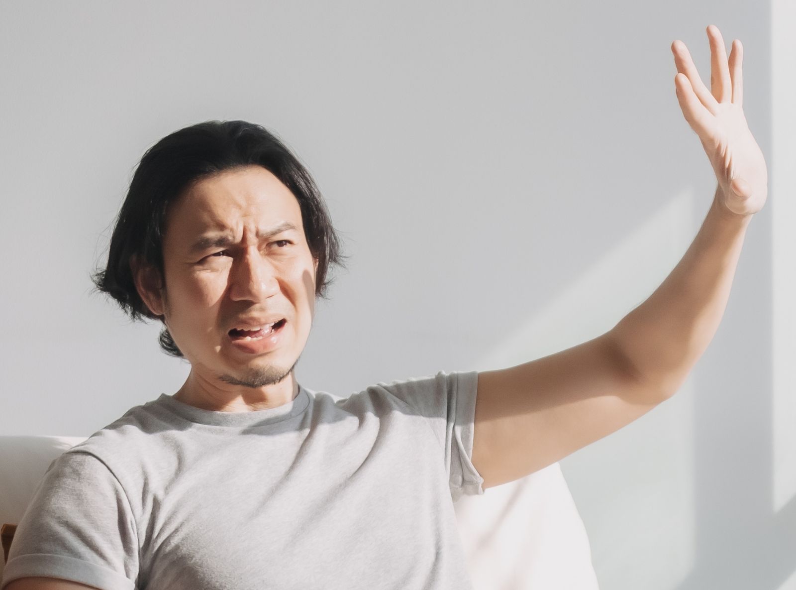 a man protecting his eyes from glare. Solarglide